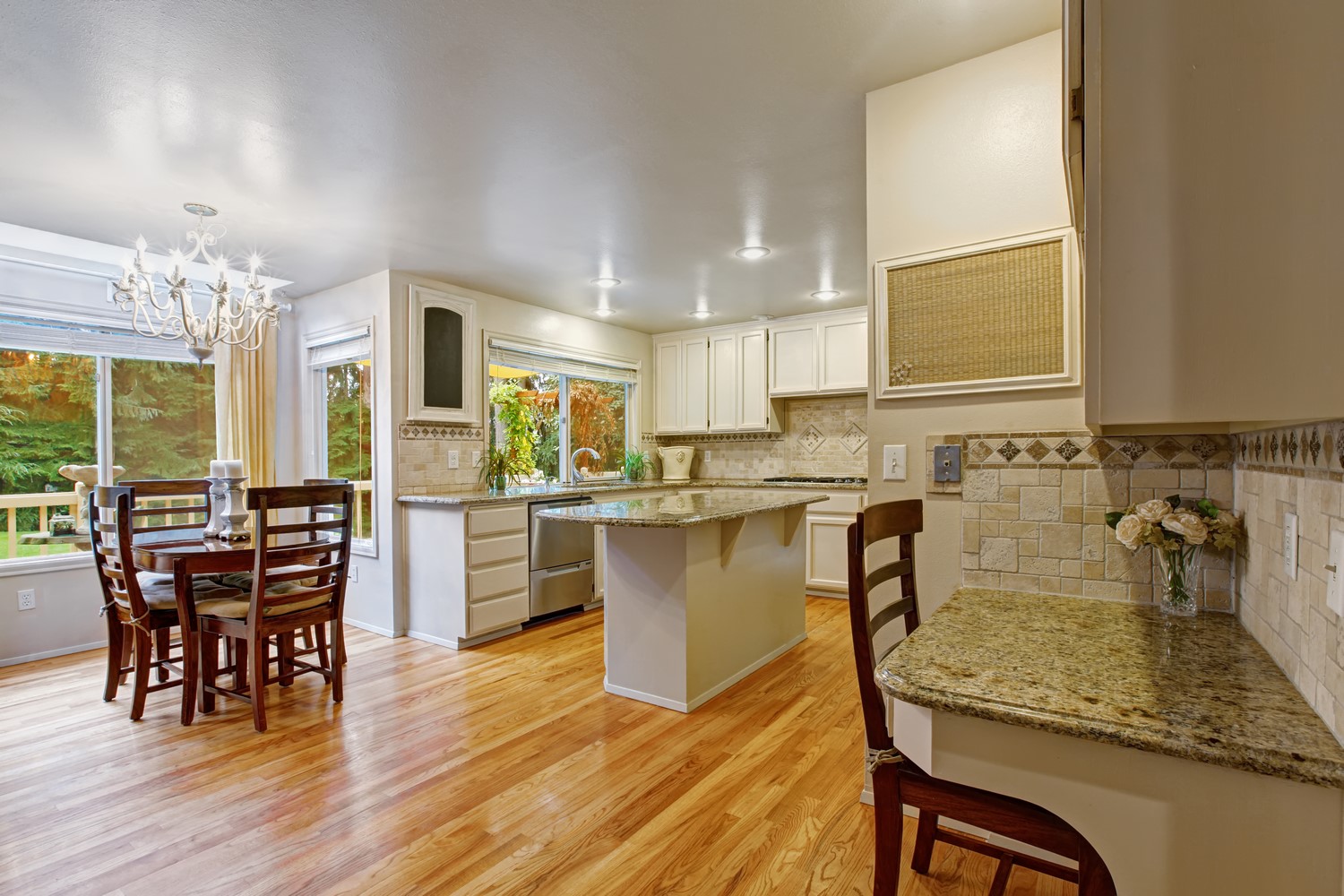 White kitchen room with hardwood flooring